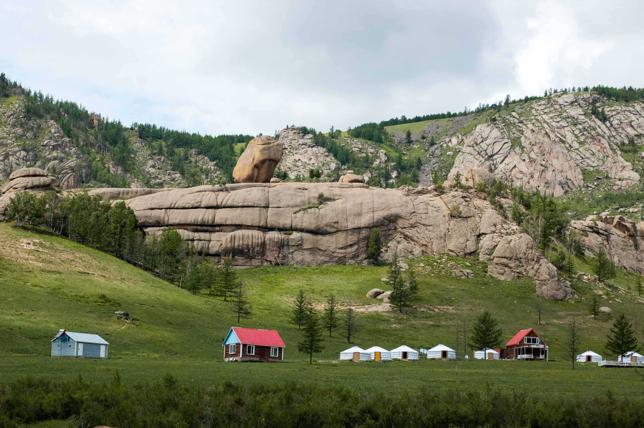 Rock formations, houses, and countryside in Mongolia