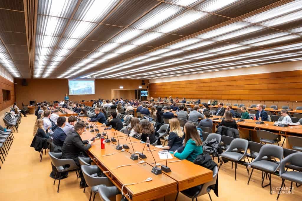 A group of people sitting in a conference room at the UN