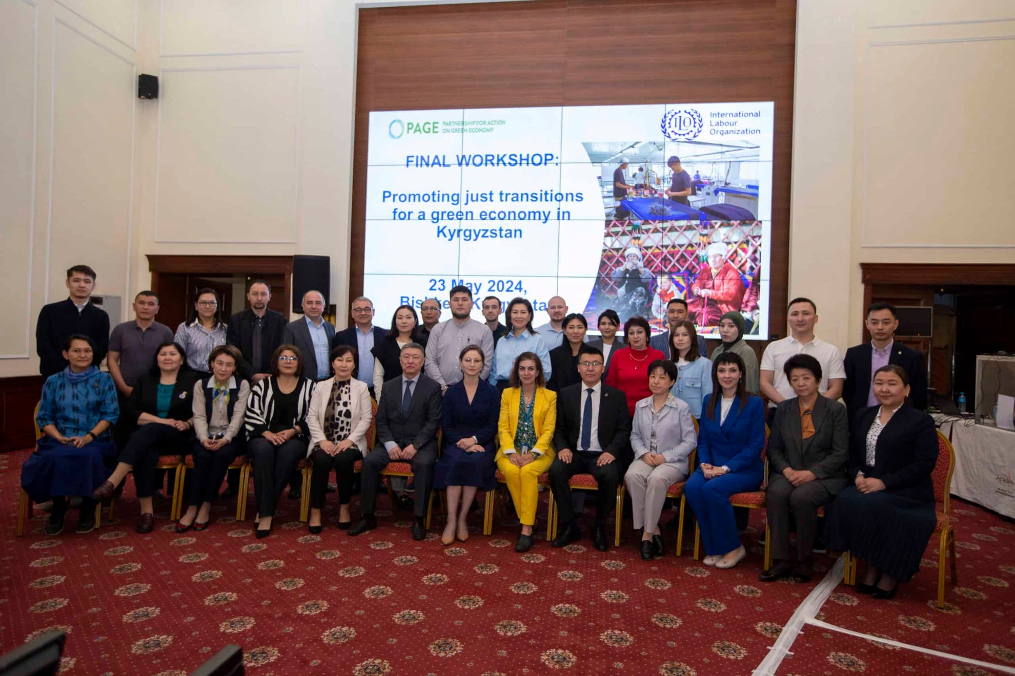 A group of people posing for a photo at the ILO Workshop on promoting just transitions for a green economy in Kyrgyzstan.