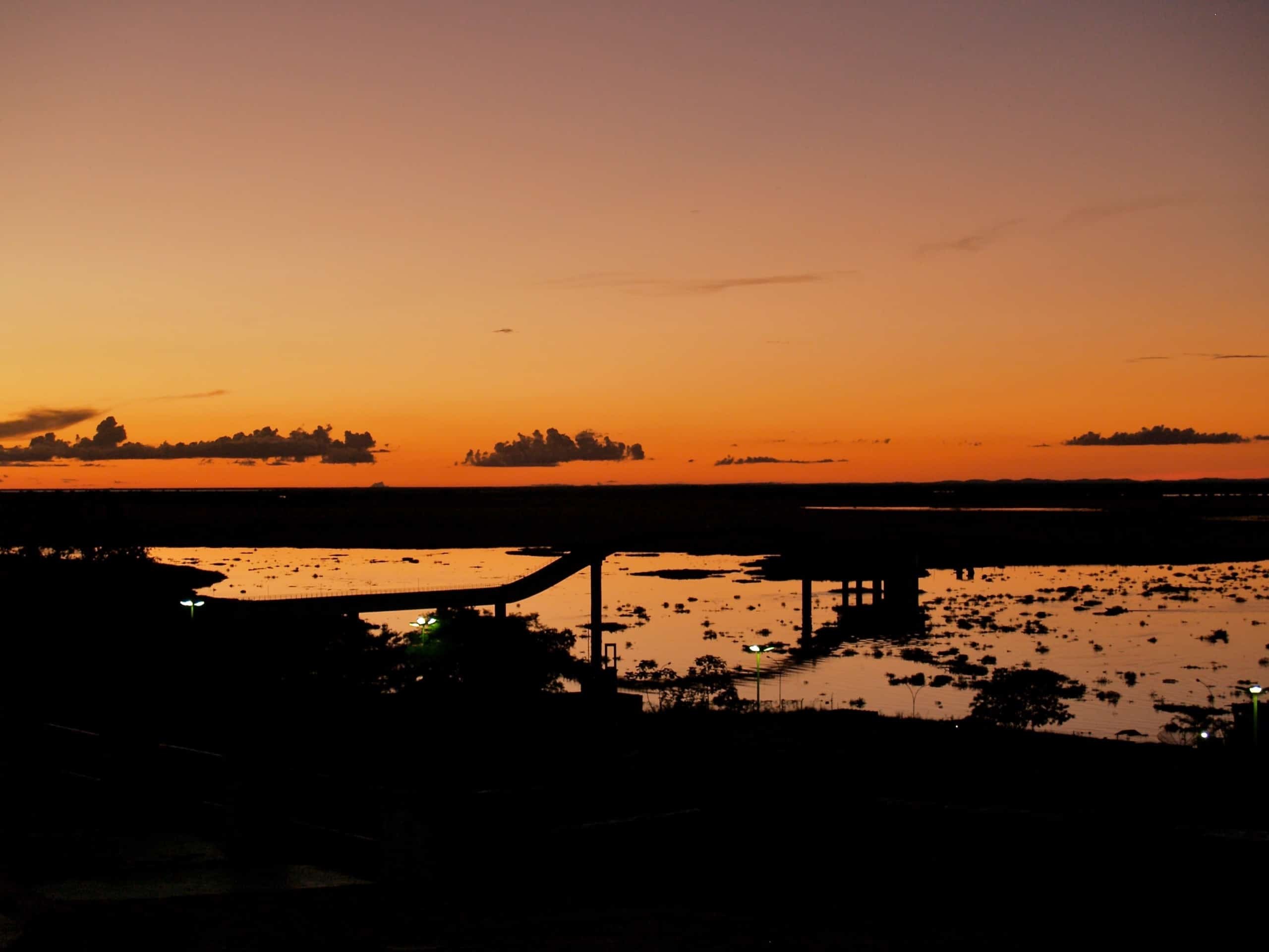 Orange sunset during low tide in Mato Grosso, Brazil